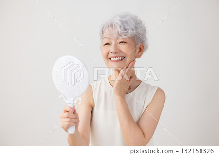 Senior woman portrait of a gray-haired woman Senior woman portrait of a gray-haired woman 132158326