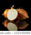 Fresh yellow onions whole and halved showing natural layers and texture on reflective black background for cooking themes 132158360