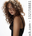 beautiful young woman with curly hair 132158881