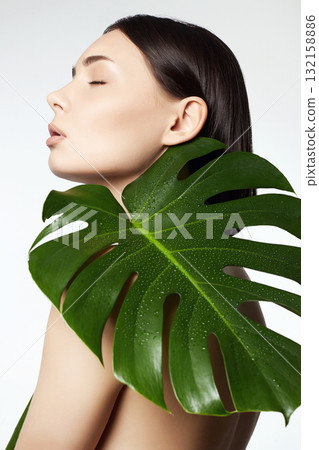 beautiful girl with palm leaves. Beautiful young naked woman beautiful girl with palm leaves. Beautiful young naked woman 132158886