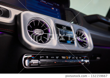 Closeup of car dashboard air vents near gear shift Closeup of car dashboard air vents near gear shift 132159667