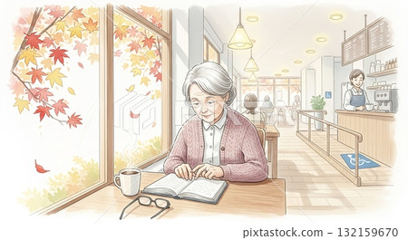 A senior woman enjoying reading in a cafe on a calm autumn day 132159670