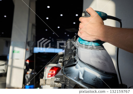 Experience the Art of Professional Car Detailing with a Polishing Tool in Action Today 132159767