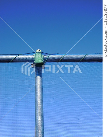 Field net and blue winter sky Field net and blue winter sky 132159877