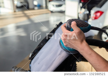 Experience the Art of Professional Car Detailing with a Polishing Tool in Action Today 132160521