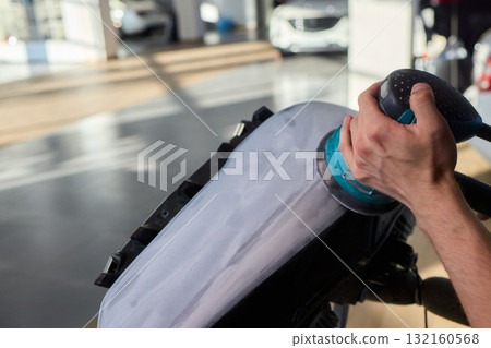 Experience the Art of Professional Car Detailing with a Polishing Tool in Action Today 132160568