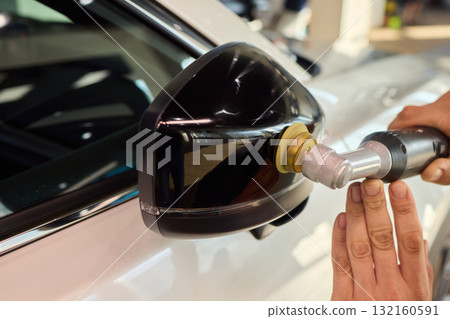 Experience the Art of Professional Car Detailing with a Polishing Tool in Action Today Experience the Art of Professional Car Detailing with a Polishing Tool in Action Today 132160591