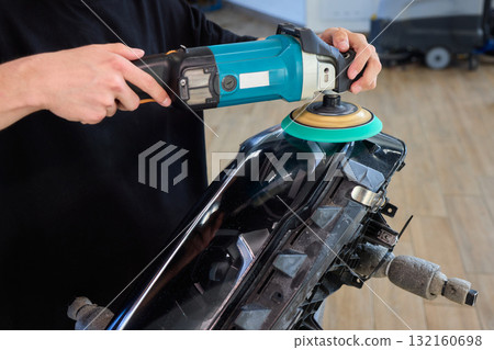 Experience the Art of Professional Car Detailing with a Polishing Tool in Action Today 132160698