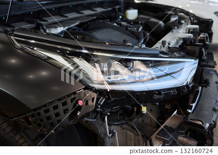 A Detailed Close Up View of an Automotive Headlight Assembly Displaying Quality and Craftsmanship A Detailed Close Up View of an Automotive Headlight Assembly Displaying Quality and Craftsmanship 132160724