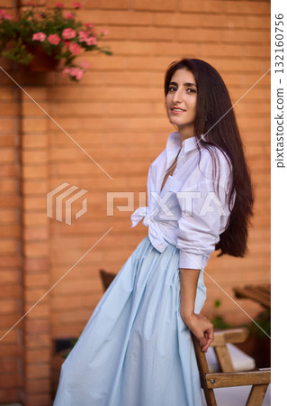 Elegant Outdoor Fashion A Stylish Woman Looking Fabulous in a Casual Yet Chic Look Elegant Outdoor Fashion A Stylish Woman Looking Fabulous in a Casual Yet Chic Look 132160756