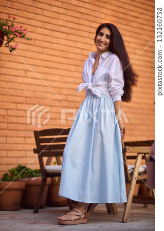 Elegant Outdoor Fashion A Stylish Woman Looking Fabulous in a Casual Yet Chic Look 132160758