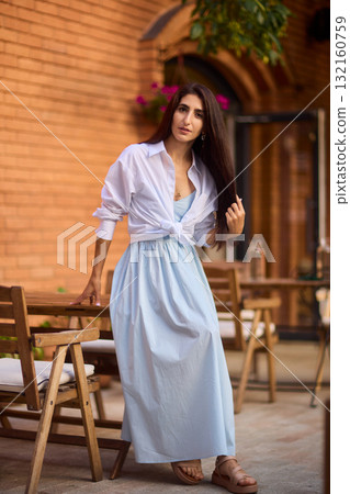 Elegant Outdoor Fashion A Stylish Woman Looking Fabulous in a Casual Yet Chic Look 132160759