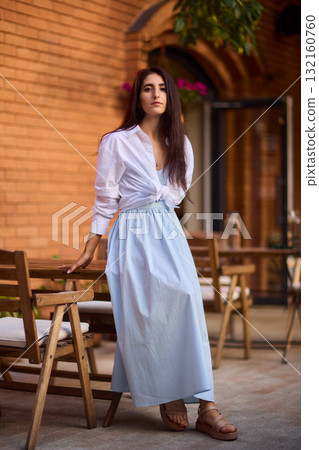 Elegant Outdoor Fashion A Stylish Woman Looking Fabulous in a Casual Yet Chic Look Elegant Outdoor Fashion A Stylish Woman Looking Fabulous in a Casual Yet Chic Look 132160760