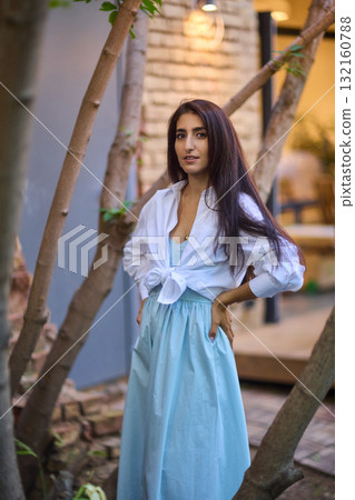 Elegant Outdoor Fashion A Stylish Woman Looking Fabulous in a Casual Yet Chic Look 132160788