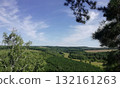 Lush Green Valley Landscape with Dramatic Skies for Outdoor Exploration 132161263