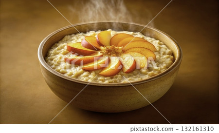 Warm bowl of oatmeal topped with fresh peach slices and a sprinkle of cinnamon Warm bowl of oatmeal topped with fresh peach slices and a sprinkle of cinnamon 132161310