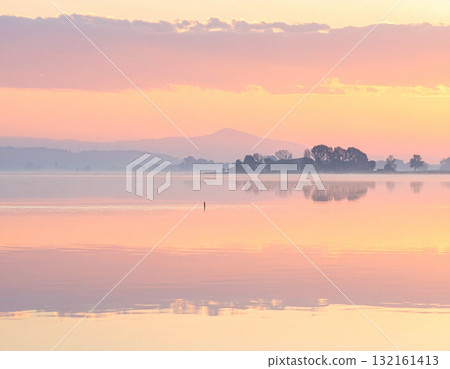 misty lake at sunrise 132161413