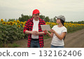 Agriculture, teamwork, business partner farmer agriculture, handshake sign of deal, harvest, fresh soil grow crops, woman farmer showing harvest business partner, agricultural farm, business people 132162406