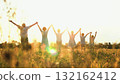 happy family, parents man woman holding children hands sunset park, mother father parents kid outdoors nature, backlit kids standing hand in hand, sunlit silhouettes of children together, family unity 132162412