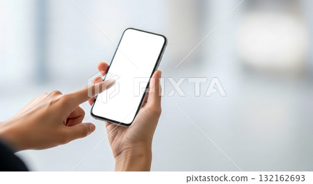 Hand holding modern smartphone with blank white screen for mockup, person touching display with finger, isolated on blurred background, mobile technology concept Hand holding modern smartphone with blank white screen for mockup, person touching display with finger, isolated on blurred background, mobile technology concept 132162693