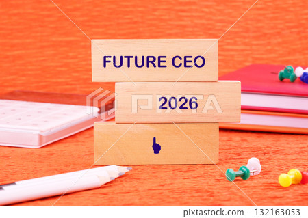Three wooden blocks are stacked with the words Future CEO and 2026, set against a colorful orange backdrop 132163053