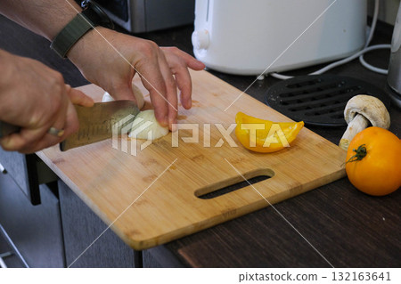 Chopping Vegetables in the Kitchen Chopping Vegetables in the Kitchen 132163641