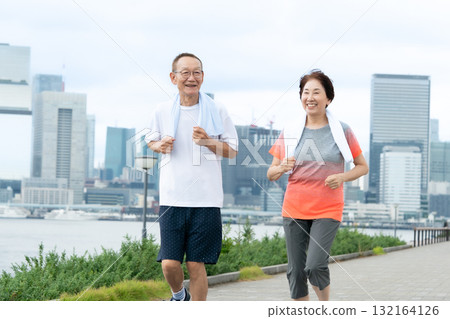 Senior couple walking jogging 132164126