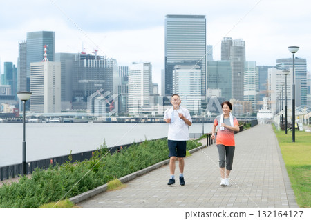 Senior couple walking jogging 132164127