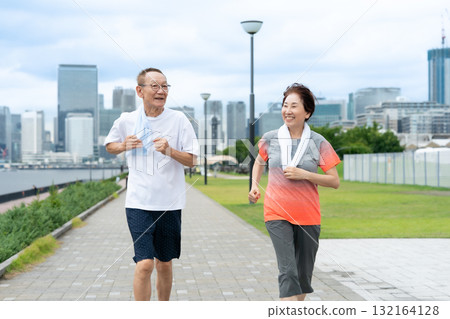 Senior couple walking jogging 132164128