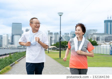 Senior couple walking jogging Senior couple walking jogging 132164130
