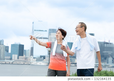 Senior couple walking jogging Senior couple walking jogging 132164135