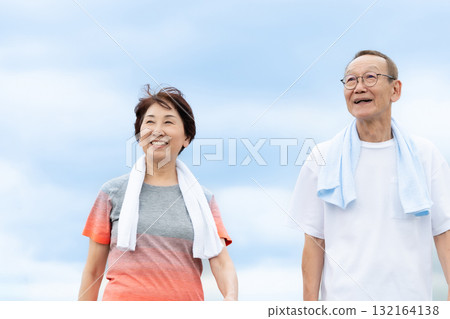 Senior couple walking jogging Senior couple walking jogging 132164138