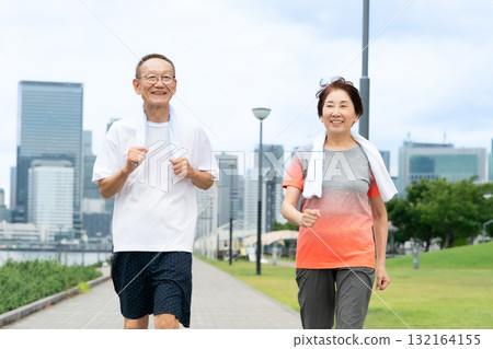 Senior couple walking jogging Senior couple walking jogging 132164155