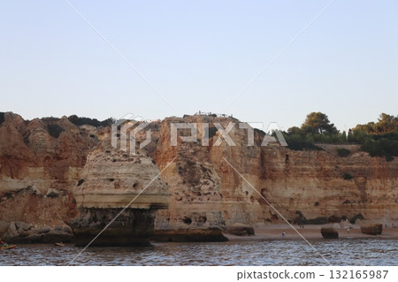 Sunlit Coastal Cliff in Algarve, Portugal Sunlit Coastal Cliff in Algarve, Portugal 132165987