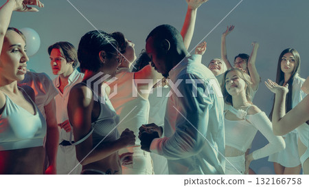 Diverse group of people enjoying Valentine day party dance floor moment 132166758