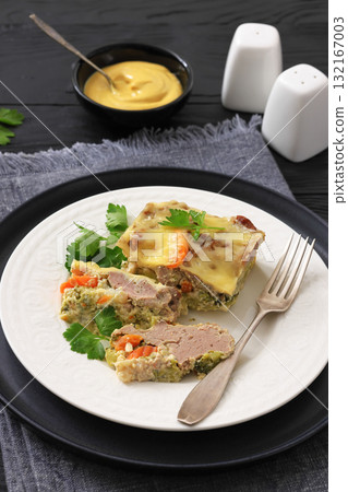 Cheesy ground meat vegetables casserole on a plate Cheesy ground meat vegetables casserole on a plate 132167003