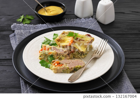 Cheesy ground meat vegetables casserole on a plate 132167004