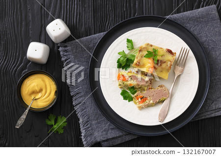 Cheesy ground meat vegetables casserole on a plate Cheesy ground meat vegetables casserole on a plate 132167007