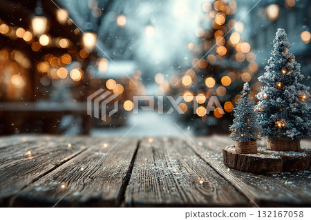A wooden pedestal with decorative Christmas trees on the right and open space. Golden bokeh lights at the back. 132167058