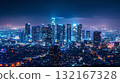 Night view of a big city and skyscrapers bathed in blue and purple light 132167328