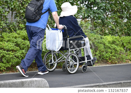 Tokyo cityscape in Japan: Aging society...Elderly people in wheelchairs... = 7th, Yokohama city 132167837