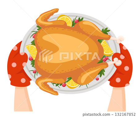 Chef holds a roast turkey with lemons and herbs on a white background. Top view 132167852