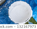 Mixing white plaster powder in construction bucket for renovation 132167973