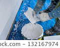 Worker applying renovation plastering stucco to exterior wall 132167974