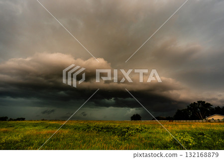 A Shelf Cloud Crawls Over Hills Beneath a Sky Ready to Explode A Shelf Cloud Crawls Over Hills Beneath a Sky Ready to Explode 132168879