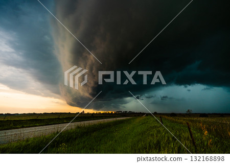 Dramatic storm quickly moves across fields and farm land bringing heavy wind and rain Dramatic storm quickly moves across fields and farm land bringing heavy wind and rain 132168898