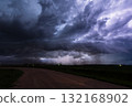 Lightning flashes light up huge ominous storm cloud 132168902