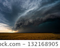 Massive Thunderheads Dominate the Sky Above a Windswept Prairie 132168905