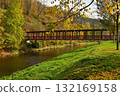 Beautiful old wooden bridge over the river in autumn time. Oslavany Czech Republic. 132169158