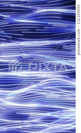 Abstract digital background of blue and white glowing dots forming smooth flowing wavy light trails Abstract digital background of blue and white glowing dots forming smooth flowing wavy light trails 132169265